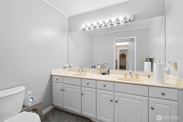 10316 NE 153rd Pl, Bothell, WA 98011 - bathroom featuring double vanity, toilet, and baseboards