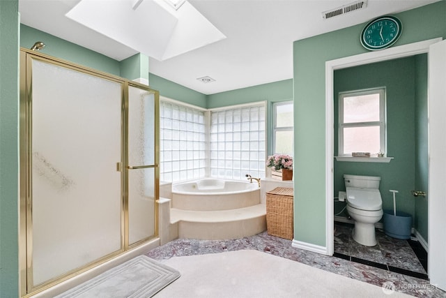 10316 NE 153rd Pl, Bothell, WA 98011 - bathroom with a bath, a stall shower, toilet, a skylight, and baseboards