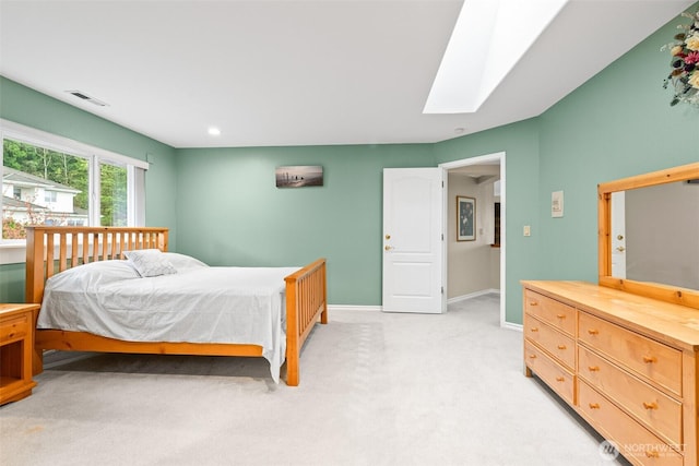 10316 NE 153rd Pl, Bothell, WA 98011 - bedroom with a skylight, light carpet, baseboards, and recessed lighting