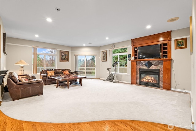 10316 NE 153rd Pl, Bothell, WA 98011 - living area featuring healthy amount of natural light, a tile fireplace, recessed lighting, and carpet floors