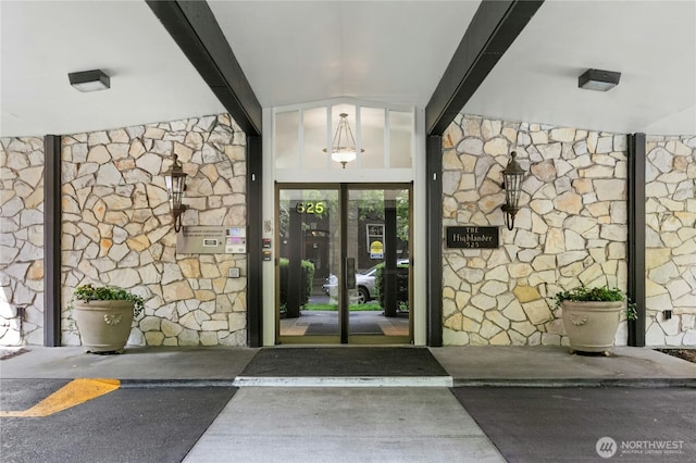 525 Belmont Ave E Unit 4F, Seattle, WA 98102 - view of exterior entry with stone siding and french doors