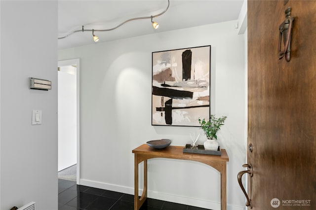 525 Belmont Ave E Unit 4F, Seattle, WA 98102 - corridor with dark tile patterned flooring and baseboards