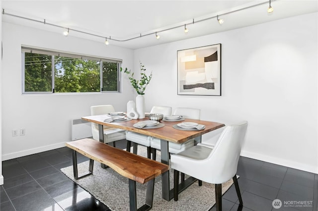 525 Belmont Ave E Unit 4F, Seattle, WA 98102 - dining room featuring dark tile patterned flooring and baseboards