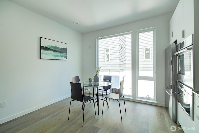 2001 S Norman St Unit B, Seattle, WA 98144 - dining area featuring light wood-type flooring and baseboards