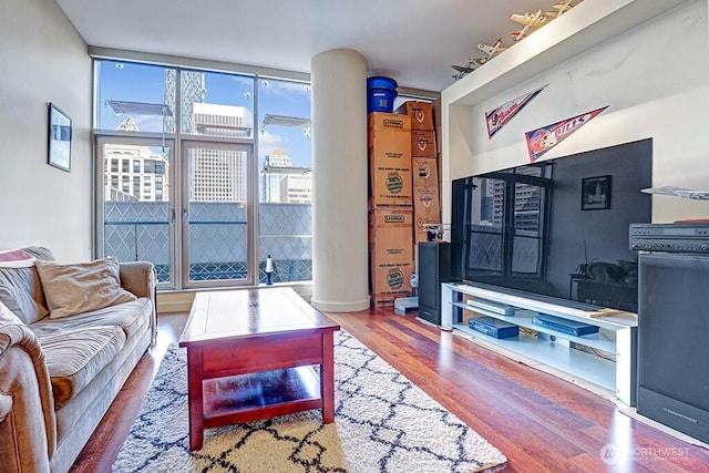 909 5th Ave Unit 1103, Seattle, WA 98164 - living room featuring wood finished floors and expansive windows