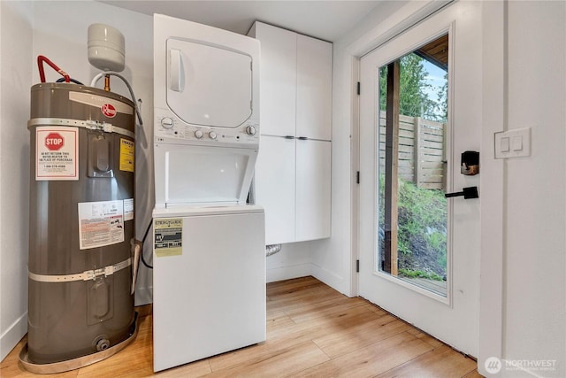 108 E Lake Stevens Rd, Lake Stevens, WA 98258 - washroom with stacked washing machine and dryer, secured water heater, and light wood-type flooring