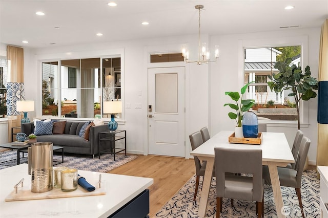 13434 HS3 NE 112th Pl, Redmond, WA 98052 - dining space featuring light wood-type flooring, a chandelier, recessed lighting, and baseboards