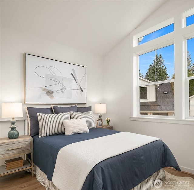 13434 HS3 NE 112th Pl, Redmond, WA 98052 - bedroom with lofted ceiling and wood finished floors