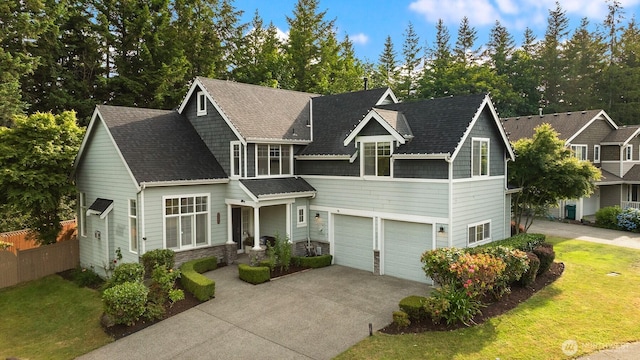 7645 Dogwood Ln SE, Snoqualmie, WA 98065 - view of front of property with a garage, driveway, stone siding, and a shingled roof