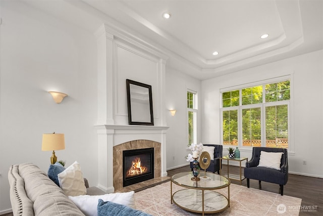 7645 Dogwood Ln SE, Snoqualmie, WA 98065 - living room with wood finished floors, a fireplace, recessed lighting, and a tray ceiling