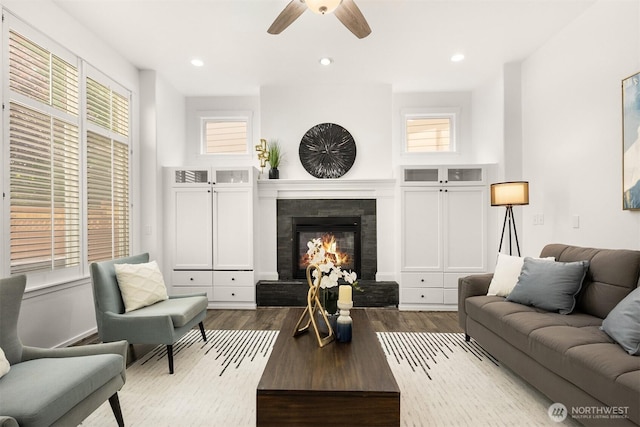 7645 Dogwood Ln SE, Snoqualmie, WA 98065 - living room featuring a fireplace, plenty of natural light, a ceiling fan, dark wood-style floors, and recessed lighting