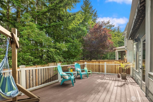 7645 Dogwood Ln SE, Snoqualmie, WA 98065 - deck featuring a fenced backyard and view of wooded area