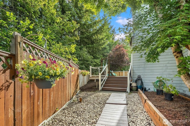 7645 Dogwood Ln SE, Snoqualmie, WA 98065 - view of yard featuring stairway and a wooden deck