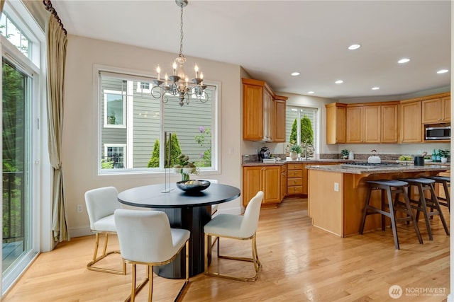 8228 NE 187th Way, Kenmore, WA 98028 - kitchen with stainless steel appliances, a chandelier, healthy amount of natural light, light wood-type flooring, and recessed lighting