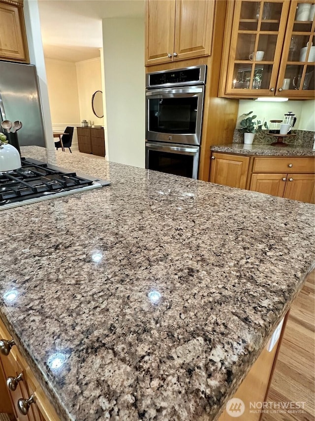 8228 NE 187th Way, Kenmore, WA 98028 - kitchen with stainless steel appliances, dark stone countertops, glass insert cabinets, and wood finished floors