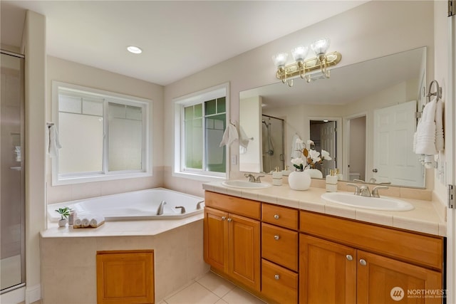 8228 NE 187th Way, Kenmore, WA 98028 - full bathroom featuring double vanity, a stall shower, a garden tub, tile patterned flooring, and a chandelier
