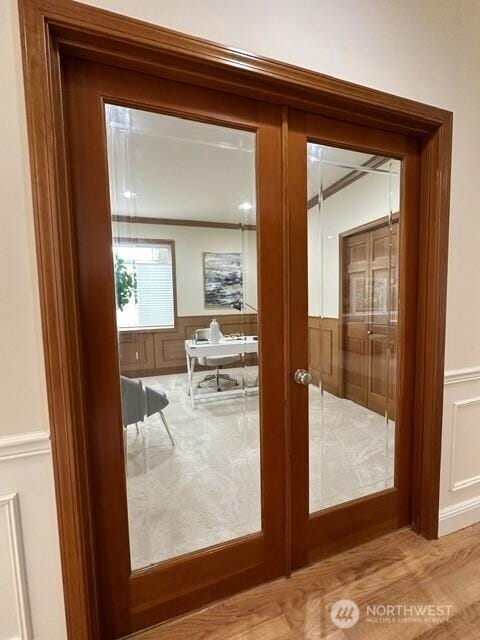 8228 NE 187th Way, Kenmore, WA 98028 - doorway to outside featuring a decorative wall, french doors, and wainscoting
