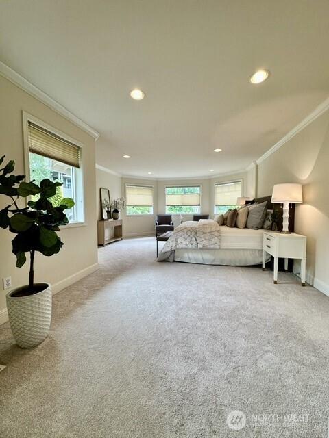 8228 NE 187th Way, Kenmore, WA 98028 - bedroom with ornamental molding, multiple windows, carpet floors, and recessed lighting