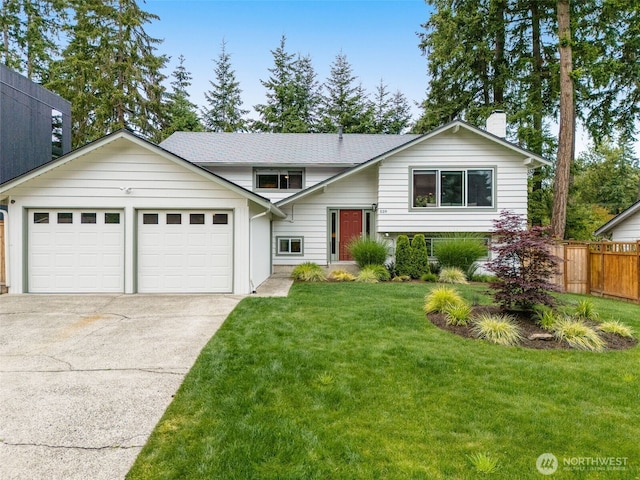 539 129th Ave SE, Bellevue, WA 98005 - bi-level home with concrete driveway, a chimney, and a garage