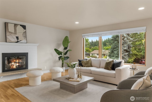 539 129th Ave SE, Bellevue, WA 98005 - living area featuring a brick fireplace, recessed lighting, and wood finished floors