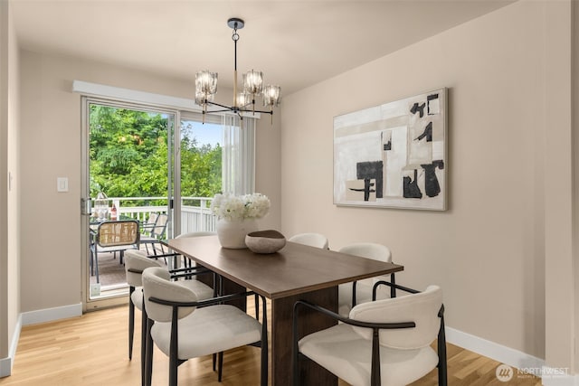 539 129th Ave SE, Bellevue, WA 98005 - dining room with a chandelier and light wood finished floors
