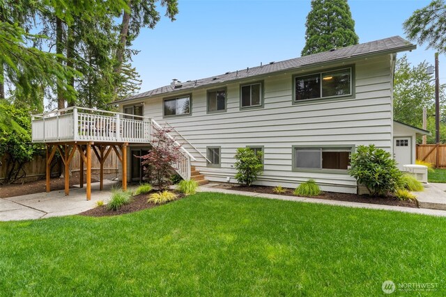 539 129th Ave SE, Bellevue, WA 98005 - back of property with a deck, stairway, and a patio