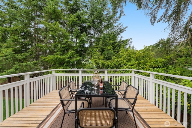539 129th Ave SE, Bellevue, WA 98005 - deck with outdoor dining area and view of wooded area
