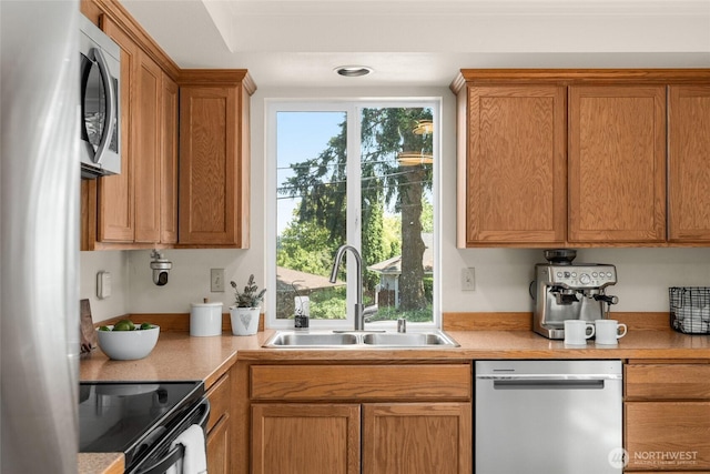 2127 170th Ave NE, Bellevue, WA 98008 - kitchen with appliances with stainless steel finishes, light countertops, and brown cabinetry