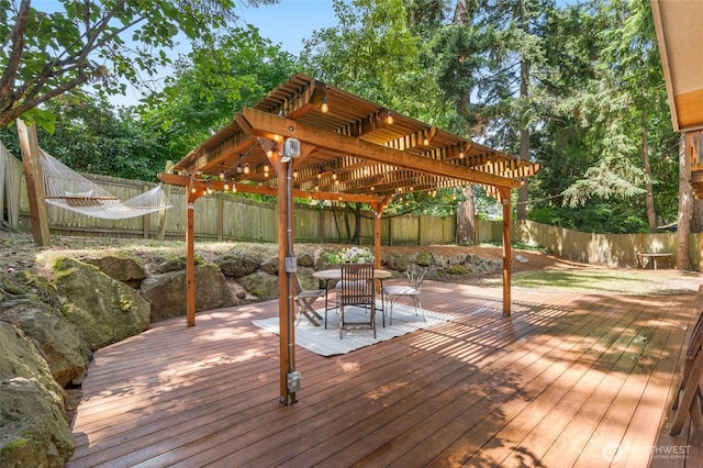 2127 170th Ave NE, Bellevue, WA 98008 - wooden terrace featuring a pergola, a fenced backyard, and outdoor dining space