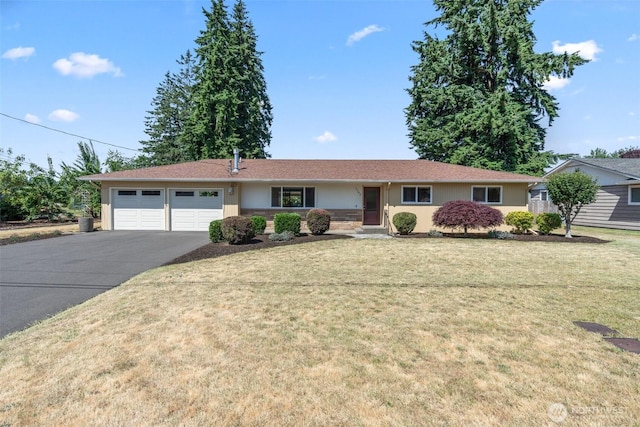 1103 Fieldcrest Ave, Centralia, WA 98531 - ranch-style house featuring driveway, an attached garage, stucco siding, and a front yard