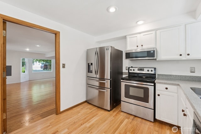 3028 124th St SE, Everett, WA 98208 - kitchen featuring stainless steel appliances, light wood-style flooring, white cabinets, and recessed lighting