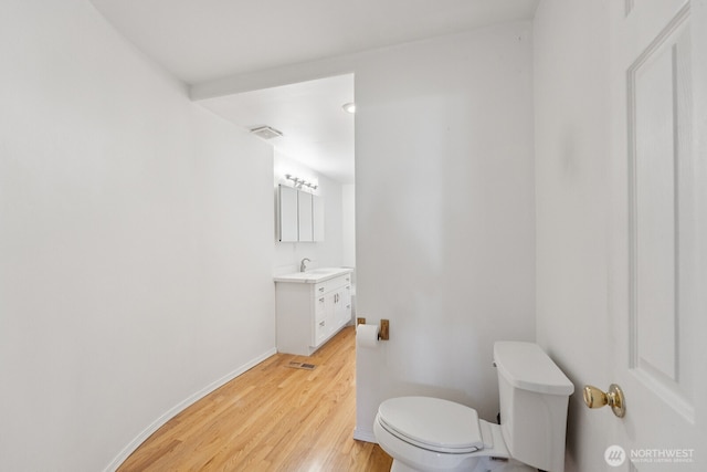 3028 124th St SE, Everett, WA 98208 - half bath featuring vanity and wood finished floors