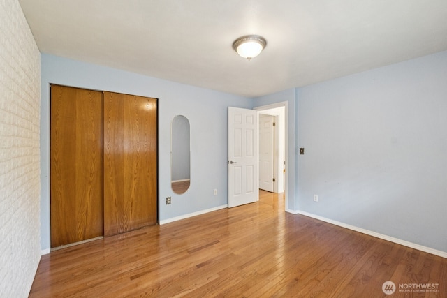 3028 124th St SE, Everett, WA 98208 - unfurnished bedroom with light wood finished floors and a closet