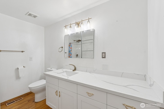 3028 124th St SE, Everett, WA 98208 - bathroom featuring vanity, wood finished floors, and a shower