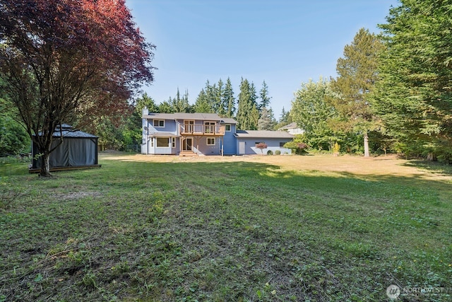 3028 124th St SE, Everett, WA 98208 - view of grassy yard with a deck and an outbuilding