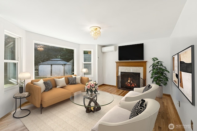 3028 124th St SE, Everett, WA 98208 - living room with a wall mounted AC, wood finished floors, and a premium fireplace