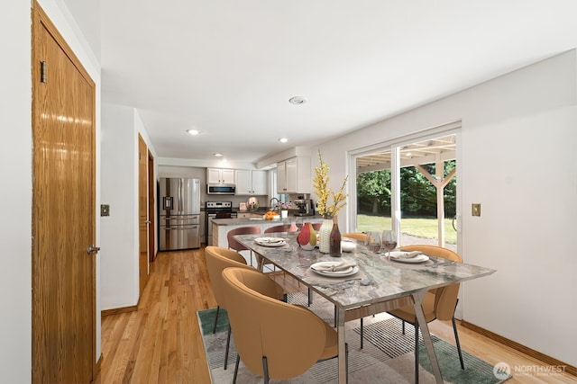 3028 124th St SE, Everett, WA 98208 - dining area with light wood finished floors and recessed lighting