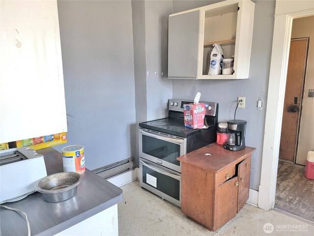 1004 N Tower Ave, Centralia, WA 98531 - kitchen with range with two ovens and baseboard heating