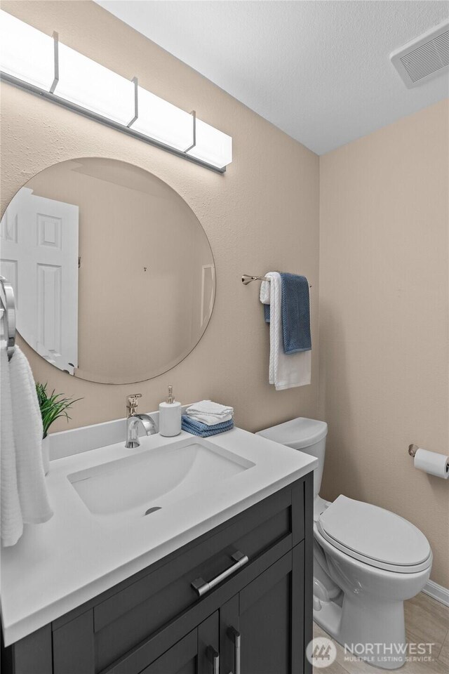 3910 Westpark Ct NW, Olympia, WA 98502 - half bathroom with vanity and toilet
