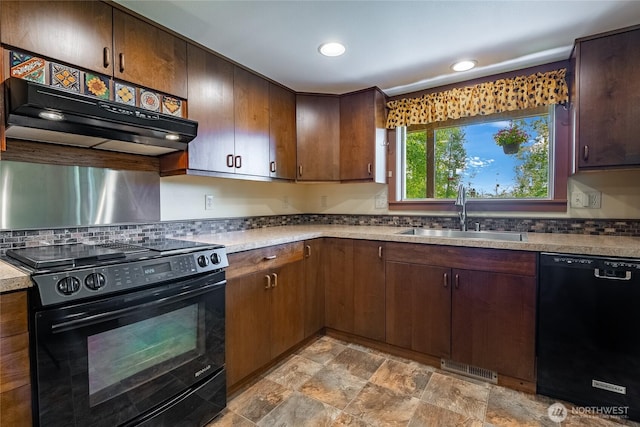 9206 Delta Line Rd, Custer, WA 98240 - kitchen with black appliances, range hood, stone finish flooring, dark brown cabinets, and recessed lighting