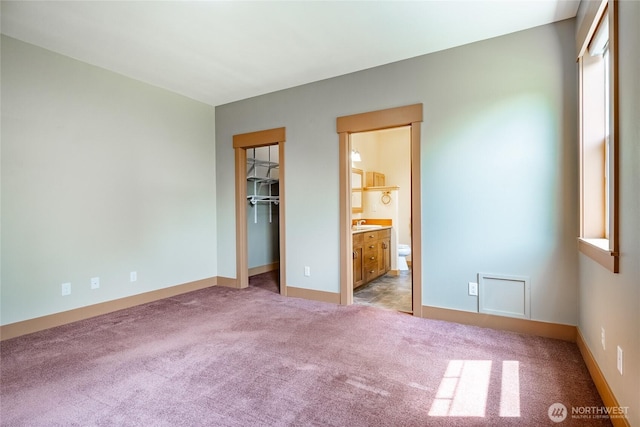 9206 Delta Line Rd, Custer, WA 98240 - unfurnished bedroom with a walk in closet, carpet, connected bathroom, and a closet