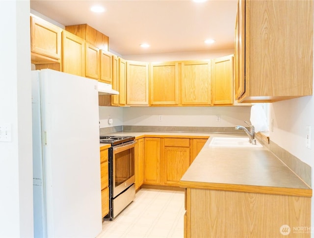 10410 206th Ave E, Bonney Lake, WA 98391 - kitchen with electric stove, freestanding refrigerator, light brown cabinets, under cabinet range hood, and recessed lighting