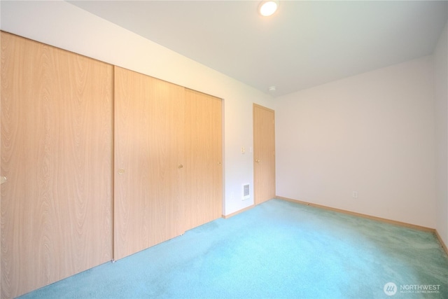 10410 206th Ave E, Bonney Lake, WA 98391 - unfurnished bedroom featuring carpet floors and a closet