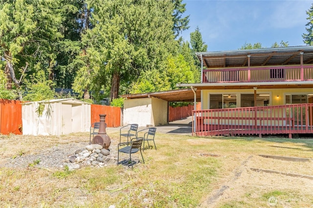 10410 206th Ave E, Bonney Lake, WA 98391 - view of yard featuring a deck and an outbuilding