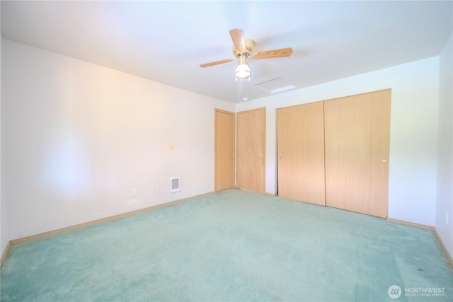 10410 206th Ave E, Bonney Lake, WA 98391 - unfurnished bedroom with light colored carpet and ceiling fan