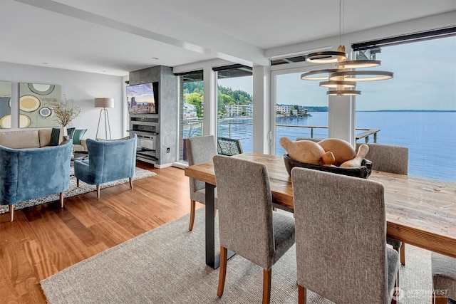 3717 Beach Dr SW Unit 207, Seattle, WA 98116 - dining room with a chandelier and wood finished floors