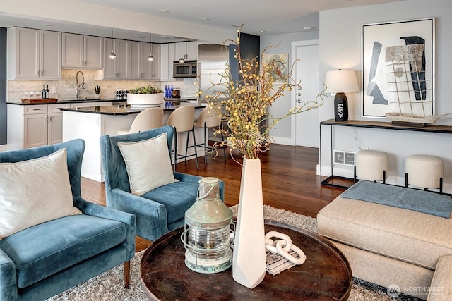 3717 Beach Dr SW Unit 207, Seattle, WA 98116 - living area with dark wood-type flooring and baseboards