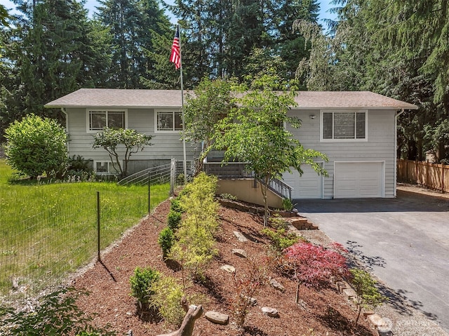 12820 E 129th St, Puyallup, WA 98374 - view of front of home with asphalt driveway and a garage