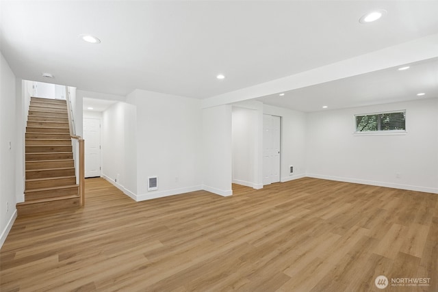 12820 E 129th St, Puyallup, WA 98374 - basement featuring stairs, light wood-type flooring, and recessed lighting