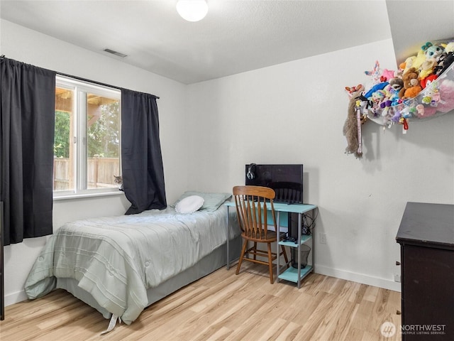 10541 Farwest Ct SE, Yelm, WA 98597 - bedroom featuring wood finished floors and baseboards